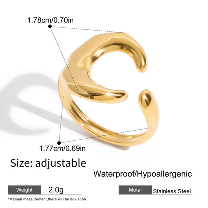 Gold earring with measurements and product details on a white background