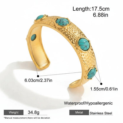 Gold bracelet with turquoise stones and measurements on a white background